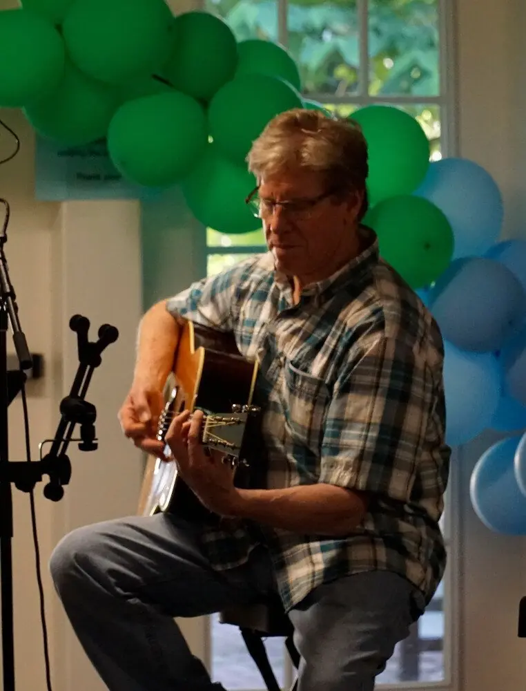 Guitarist performing at the Open Mic