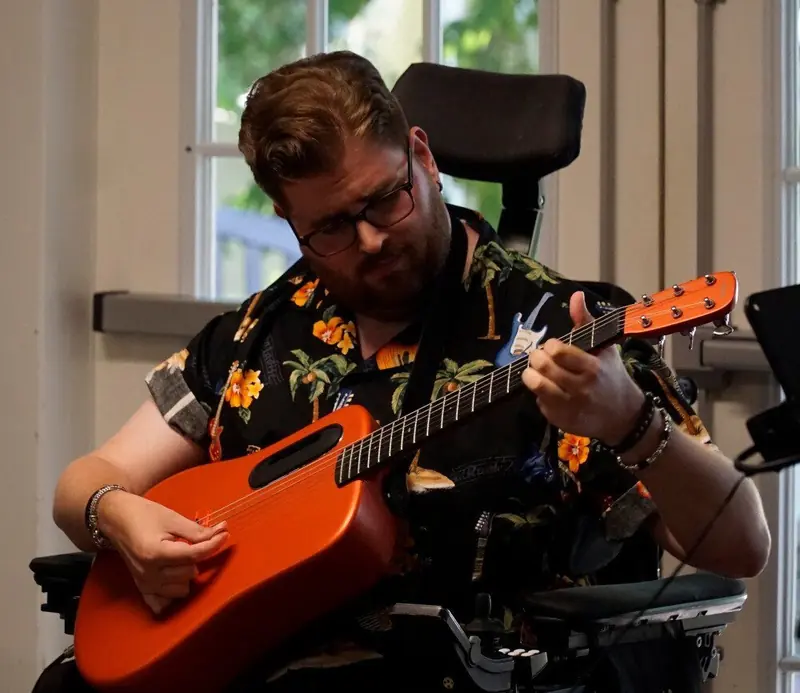 Musician performing at the Open Mic